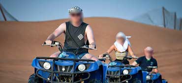 ATV rental Dubai ride through golden Lahbab desert dunes