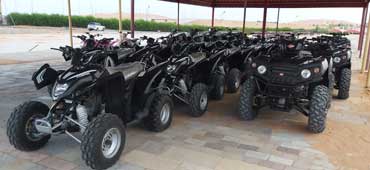 Self-drive Quad Bike Dubai adventure in Lahbab Desert with golden sand dunes